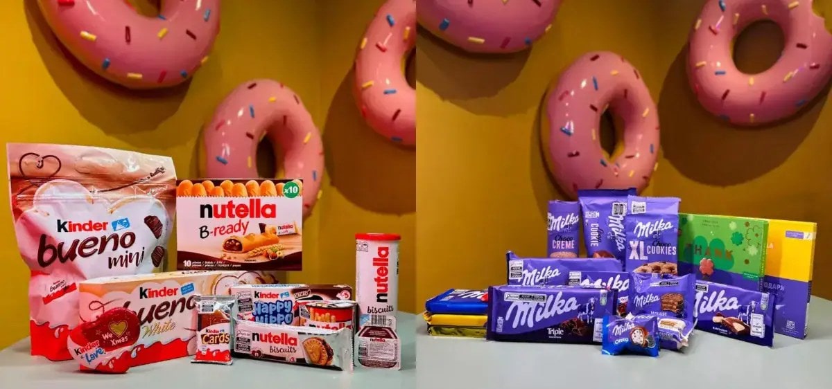 Chocolates e doces importados à venda na Fabulosa Máquina de Doces, com donuts gigantes na parede, em Gramado