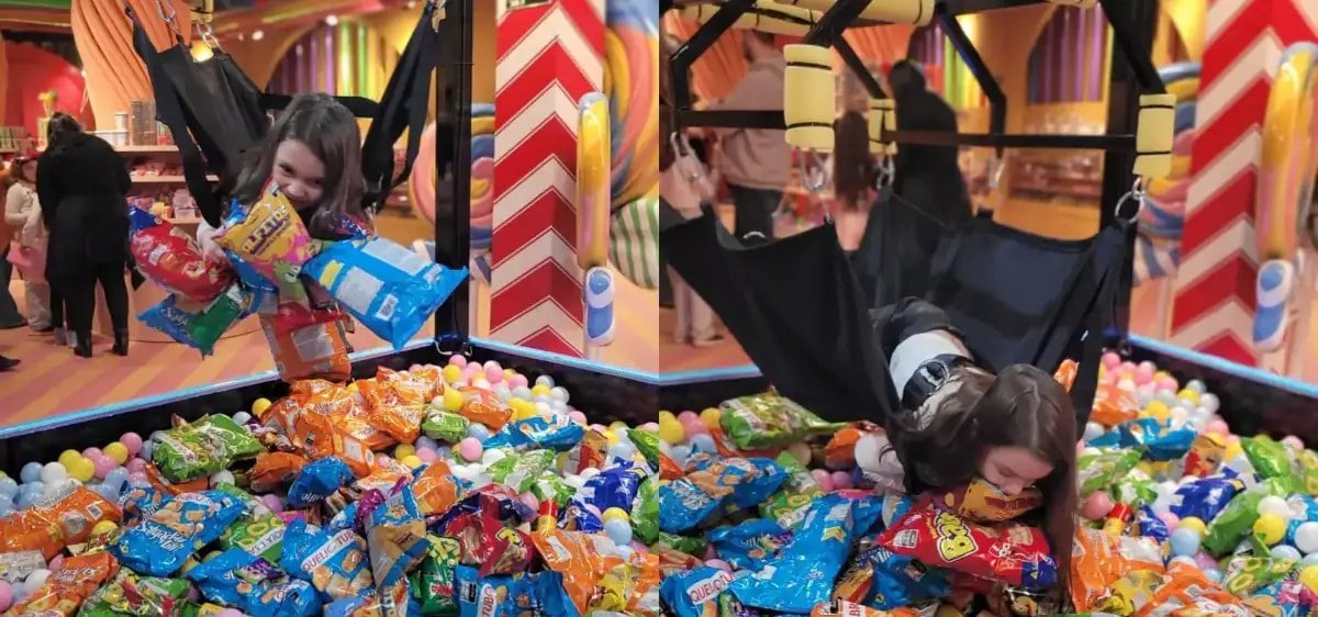 Crianças na Garra Humana da Fabulosa Máquina de Doces, descendo sobre a piscina de bolinhas e salgadinhos em Gramado